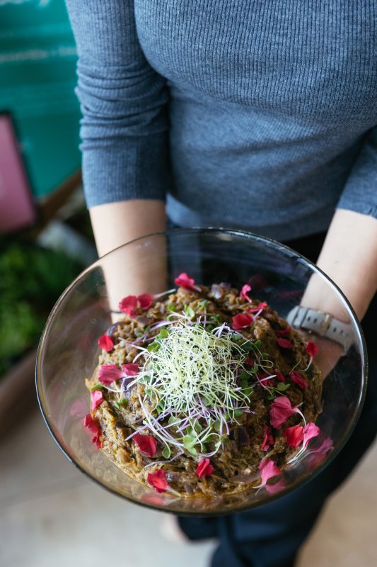 Tasting — a bowl with sprouts and edible flowers